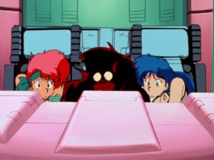 Kei, Yuri & Mughi peer at their screen in a header image for Dirty Pair OVA podcast.